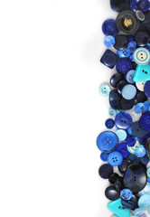 Multicolored accessories for sewing, bright threads, buttons and cloth