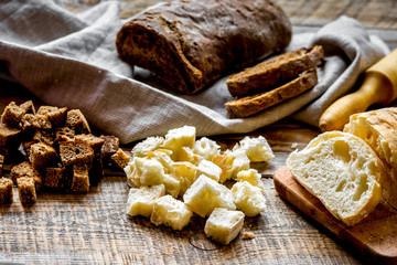 traditional sliced bread with crumbs wooden table background