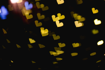 The bokeh of heart shape from the beautiful colourful light decoration at night