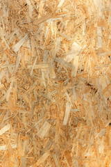 Background of wooden sawdust, osb, wooden texture, natural pattern, minimalistic blank for the designer, abstract, retro style