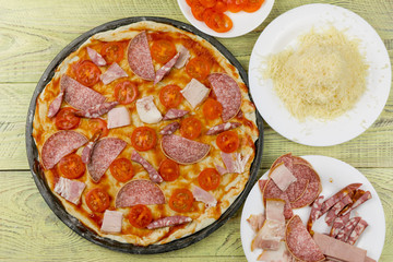 Fresh original Italian raw pizza, dough preparation in traditional style.