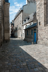 Fototapeta premium Cobblestone alley, Brittany, France, Europe