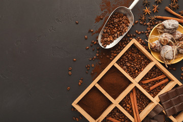 Top view on scattered coffee beans and spices, background with copy space