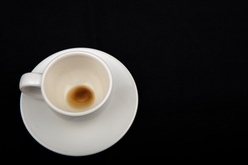 Empty coffee cup on black background