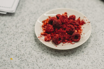 dried raspberry on the plate on the table