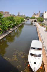 Fototapeta na wymiar Canada Parliament Buildings and Rideau Canal, Ottawa, Ontario, Canada. Rideau Canal was registered as a UNESCO World Heritage Site.
