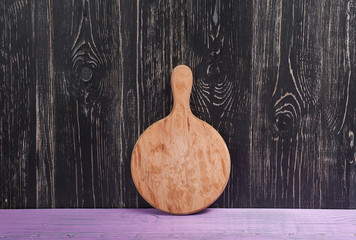 Cutting Board on purple a black background