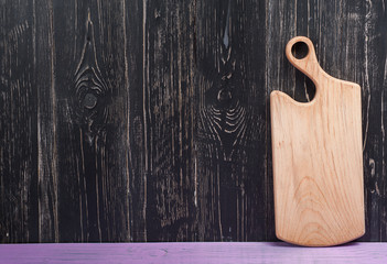 Cutting Board on purple a black background