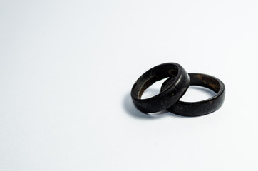 pair of coconut rings together on a white background. Intense black tone. Handicraft common in the northeast of Brazil. indigenous ring. Tucum ring.