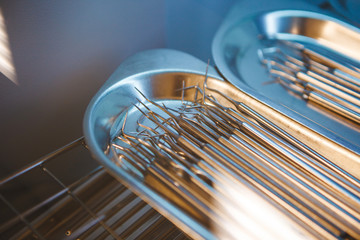 Metal manual dentist tools for procedures in metal dish