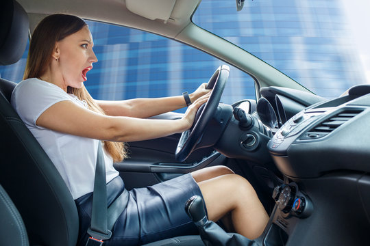 Young Frightened Driver Woman Squealing Brakes Avoiding An Accident