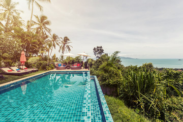 Private swimming pool near luxury villa. Sunny summer vacation