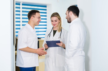 Group of doctors discussing and working together