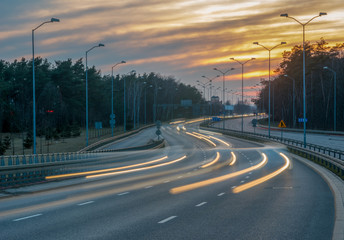 Fototapeta na wymiar evening traffic on the highway