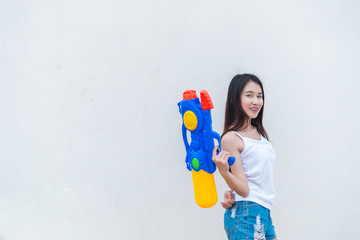 Asian sexy woman with water in hand on white background,Festival songkran day at thailand,The best of festival of thai,Land of smile