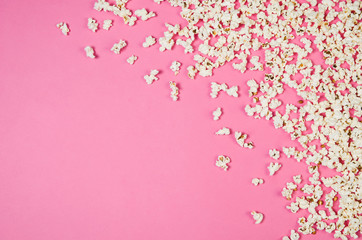 Fresh popcorn pattern isolated on pink background top view. Frame composition with copy space.