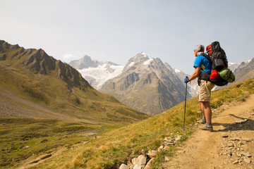 Fototapeta premium campaign through mountains with a tent 