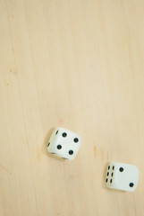 dice on wooden board