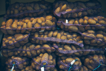 potatoes in bags. grocery shopping. stock of vegetables