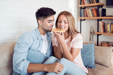 Couple enjoying pizza