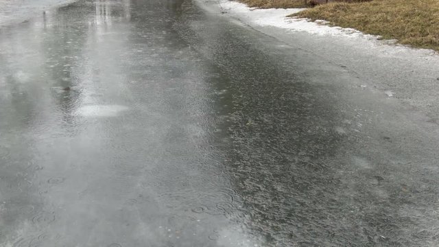 Spring rain on lake ice nature background