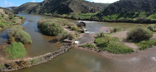 Aerial view Guadiana river with the old traditional watermills at Azenhas Mertola. Alentejo, Portugal