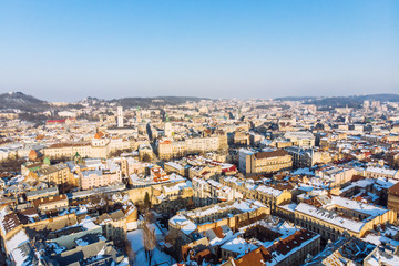 bird's eye view of old european city in winter day on sunset