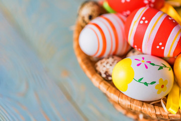 Fototapeta na wymiar Several colorful Easter eggs in basket close
