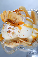 banana ice creamnd with nuts and whipped cream  