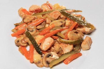chicken breast with vegetables and mushrooms in a creamy sauce 