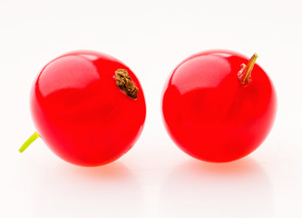 Red currant berries on a white background