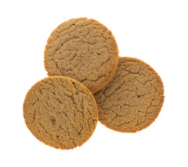 Top view of three brown sugar and cinnamon cookies isolated on a white background.