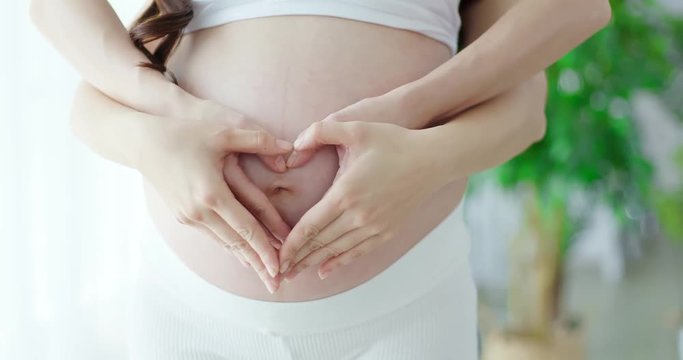 close up pregnant women belly