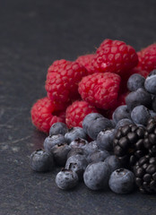 Fruits of the Forest, Raspberries, Blueberries and Blackberries, on a Slate Cutting Board