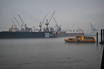 Fototapeta premium Hamburg, Germany, ships in a misty port