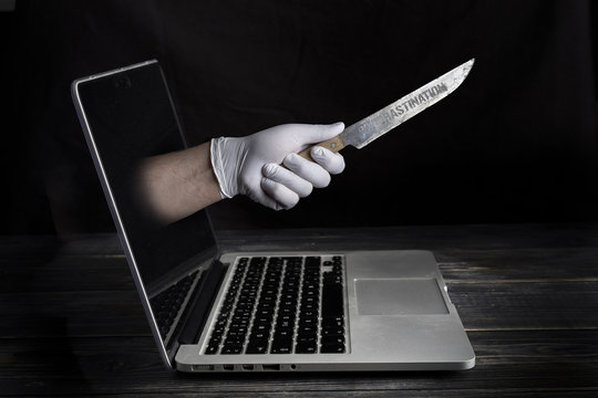 procrastination knife from scren of the laptop procrastination concept