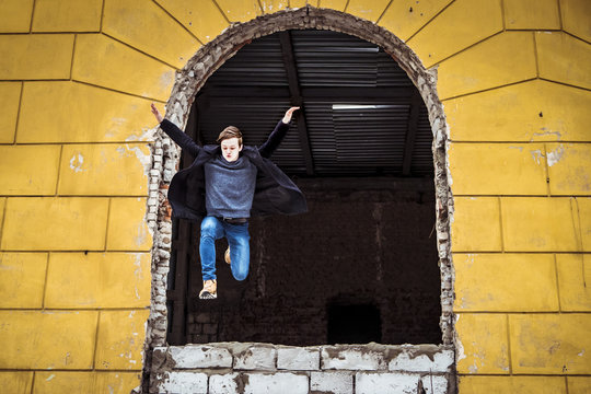 Young Man Jumps Out From Window Escape From Abandoned Building