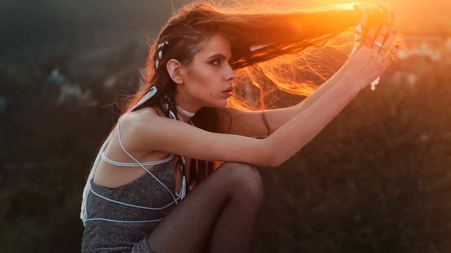 Sensual girl at the sunset. Beauty romantic girl outdoors. beautiful woman in sun light. Blowing long hair. Autumn. Glow sun, sunshine. Backlight. Subculture. Emo girl. Postapocalypse girl. Steampunk.