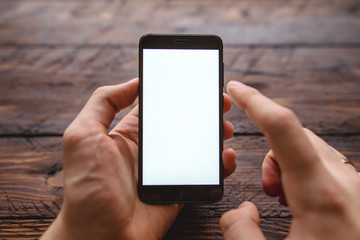 Mockup of blank screen of smartphone, male hand holding smartphone with template screen with area for your logo or design