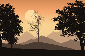 Mountain landscape with trees and one lone dead trees, the orange sky with the sun
