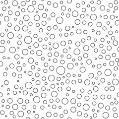 Seamless background with random black bubbles. Abstract ornament. Dotted abstract pattern