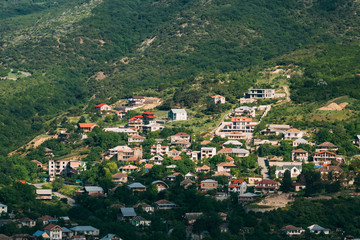 Fototapeta na wymiar Mtskheta Georgia. Top View Of New Cottage Village Surrounded By 