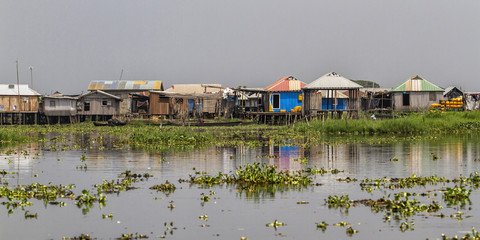 The village of Ganvie ying in Lake Nokoué, near Cotonou in Benin - obrazy, fototapety, plakaty