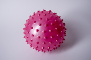 Pink violet colorful bright isolated spiky ball toy. massaege ball on white.