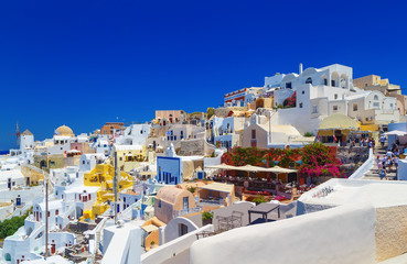 View of Oia with tourists most beautiful village of Santorini island in Greece