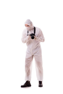 Forensic specialist in protective suit taking photos on white