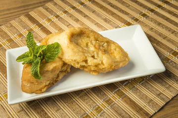 French toast in a rectangular dish on a bamboo mat