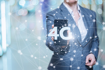Businesswoman with phone showing 4g.