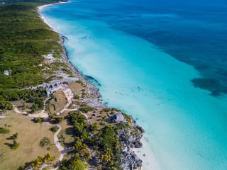Ruins of Tulum, Mexico overlooking the Caribbean Sea in the Riviera Maya Aerial View. Tulum beach Quintana Roo Mexico - drone shot. White sand beach and ruins of Tulum.