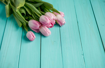 tulips bouquet on  wooden background